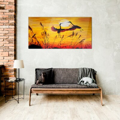 Tableau sur verre Grues dansantes au coucher du soleil