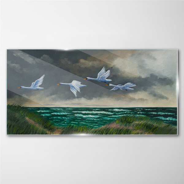 Tableau imprimé sur verre Vol de cygnes au dessus de la mer