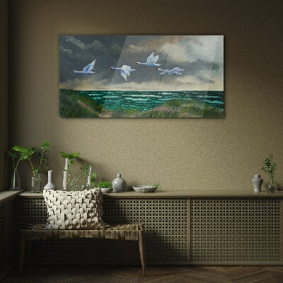 Tableau imprimé sur verre Vol de cygnes au dessus de la mer