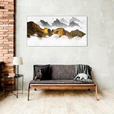 Tableau verre imprimé Des montagnes dorées dans les nuages
