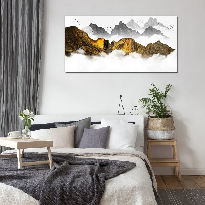 Tableau verre imprimé Des montagnes dorées dans les nuages