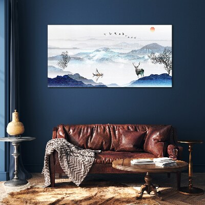 Tableau sur verre Un paysage de montagne paisible avec un cerf
