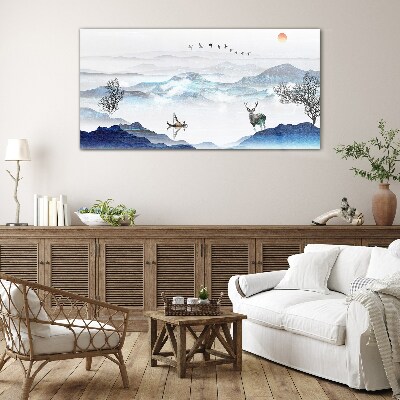 Tableau sur verre Un paysage de montagne paisible avec un cerf