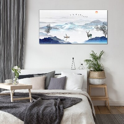 Tableau sur verre Un paysage de montagne paisible avec un cerf