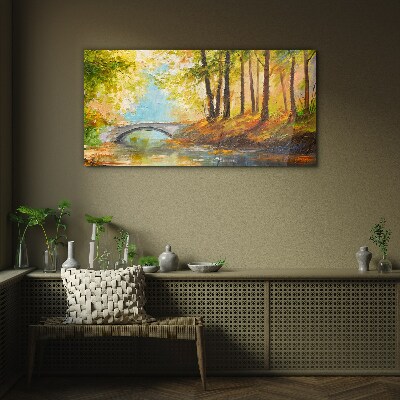 Tableau imprimé sur verre Un pont dans la forêt d'automne