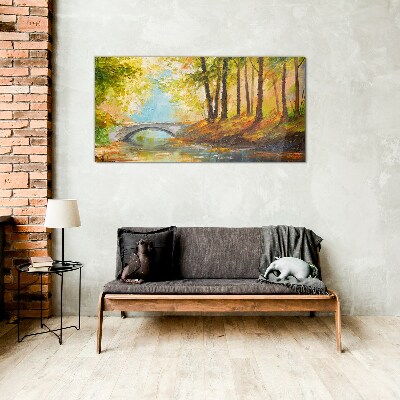 Tableau imprimé sur verre Un pont dans la forêt d'automne