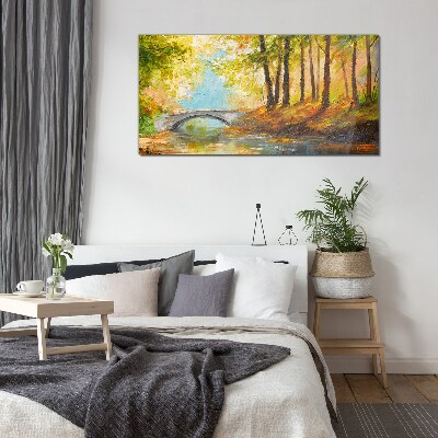 Tableau imprimé sur verre Un pont dans la forêt d'automne