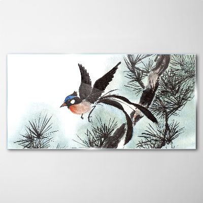Tableau verre imprimé Un oiseau en vol au-dessus des pins