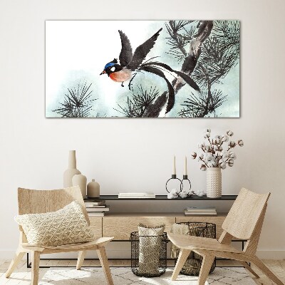 Tableau verre imprimé Un oiseau en vol au-dessus des pins