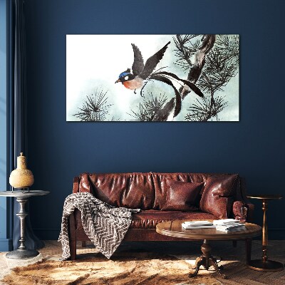 Tableau verre imprimé Un oiseau en vol au-dessus des pins