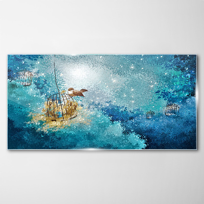 Tableau sur verre Un oiseau en cage contre le ciel