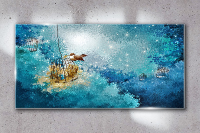 Tableau sur verre Un oiseau en cage contre le ciel