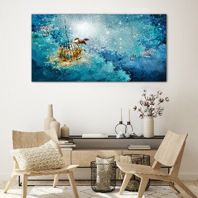 Tableau sur verre Un oiseau en cage contre le ciel