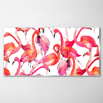 Tableau verre imprimé Flamants roses dans une danse tropicale