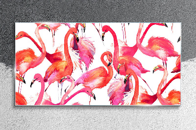 Tableau verre imprimé Flamants roses dans une danse tropicale