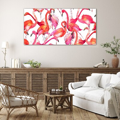 Tableau verre imprimé Flamants roses dans une danse tropicale