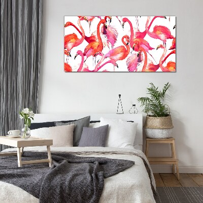 Tableau verre imprimé Flamants roses dans une danse tropicale