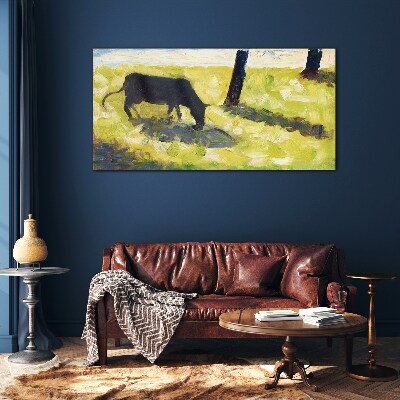 Tableau sur verre Une vache broutant dans un paysage verdoyant