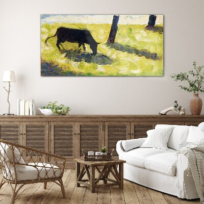 Tableau sur verre Une vache broutant dans un paysage verdoyant
