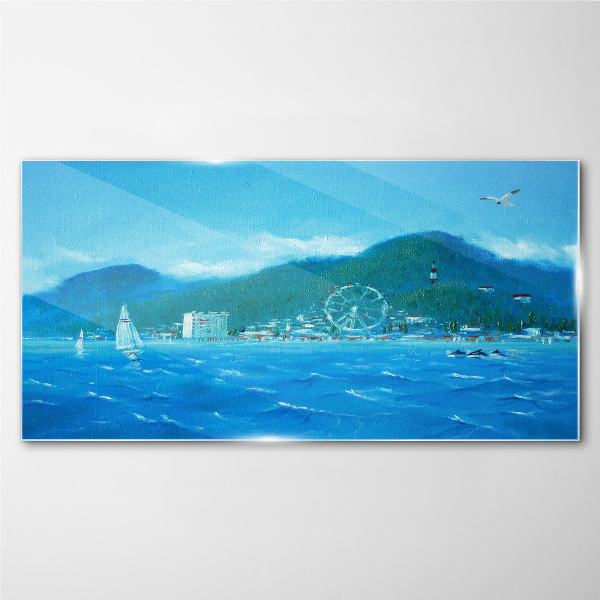 Tableau imprimé sur verre Paysage de bord de mer avec un parc d'attractions