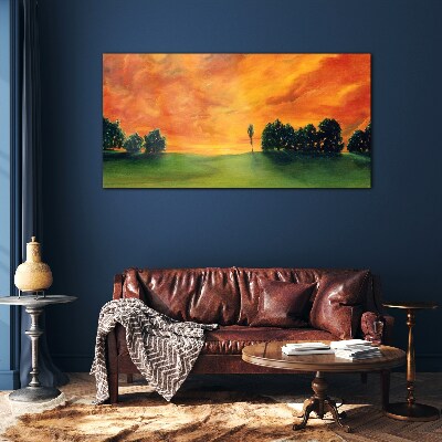 Tableau imprimé sur verre Coucher de soleil sur une colline verdoyante