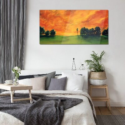 Tableau imprimé sur verre Coucher de soleil sur une colline verdoyante