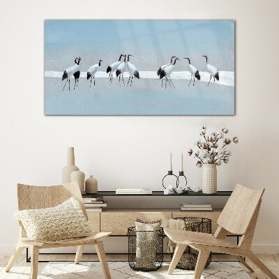 Tableau imprimé sur verre Volées de grues sur fond bleu
