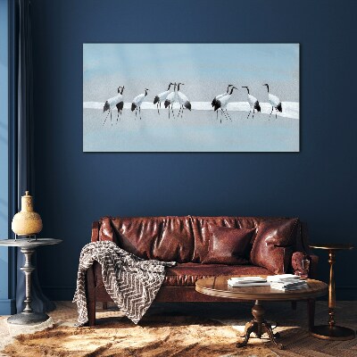 Tableau imprimé sur verre Volées de grues sur fond bleu