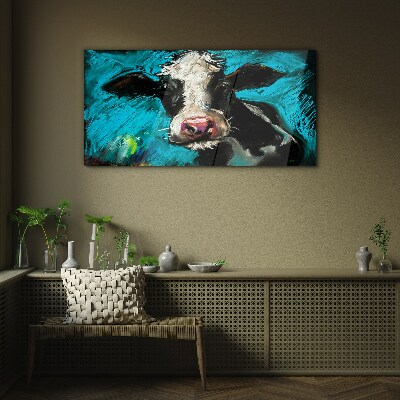 Tableau imprimé sur verre Portrait d'une vache sur fond bleu