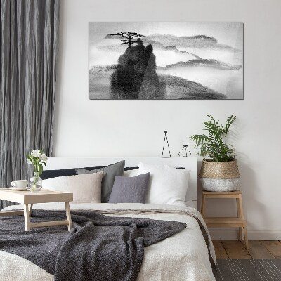 Tableau en verre Un arbre solitaire sur une montagne rocheuse