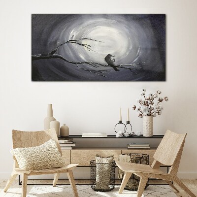 Tableau imprimé sur verre Un oiseau solitaire sur une branche