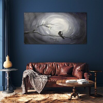 Tableau imprimé sur verre Un oiseau solitaire sur une branche