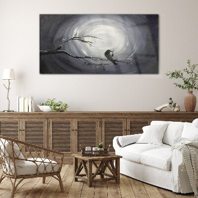Tableau imprimé sur verre Un oiseau solitaire sur une branche