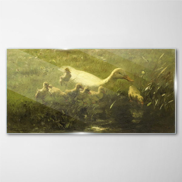 Tableau verre imprimé Un canard avec des poussins dans l'herbe