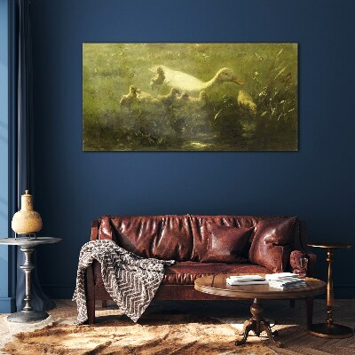 Tableau verre imprimé Un canard avec des poussins dans l'herbe