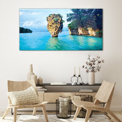 Tableau en verre Une baie calme avec un haut rocher