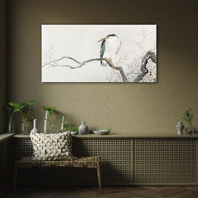 Tableau sur verre Un oiseau sur une branche dans un paysage délicat