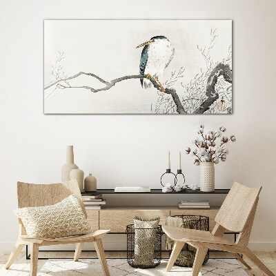 Tableau sur verre Un oiseau sur une branche dans un paysage délicat