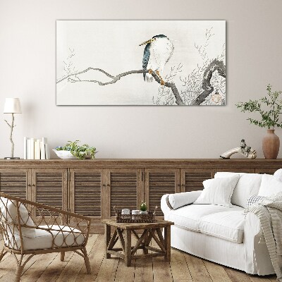 Tableau sur verre Un oiseau sur une branche dans un paysage délicat