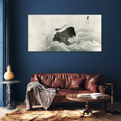 Tableau photo sur verre Un oiseau sur un rocher dans les vagues