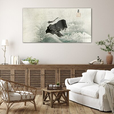 Tableau photo sur verre Un oiseau sur un rocher dans les vagues