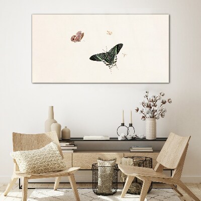 Tableau verre imprimé Des papillons dans une danse délicate