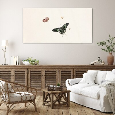 Tableau verre imprimé Des papillons dans une danse délicate