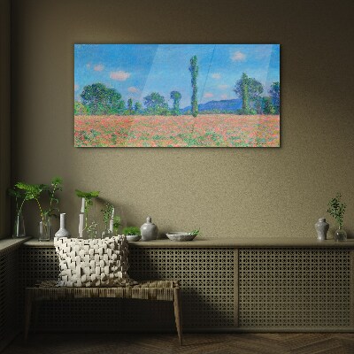 Tableau sur verre Un champ de fleurs sous un ciel bleu