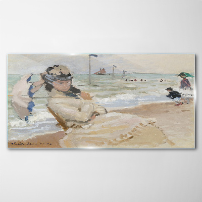 Tableau photo sur verre Femme sur la plage avec un parasol