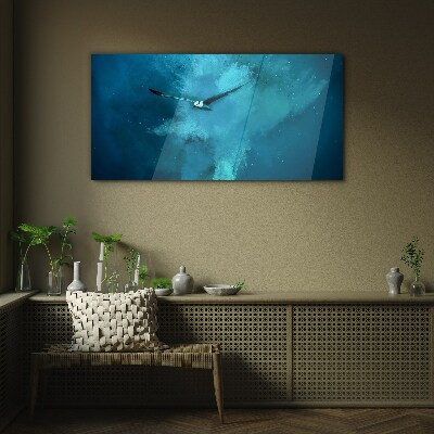 Tableau photo sur verre Un oiseau dans l'espace bleu
