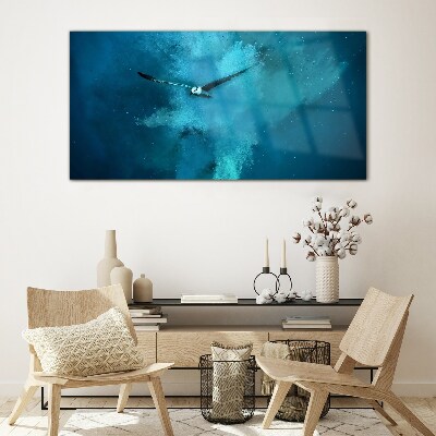 Tableau photo sur verre Un oiseau dans l'espace bleu
