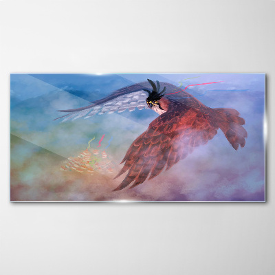 Tableau sur verre Vol d'un oiseau de proie dans les nuages