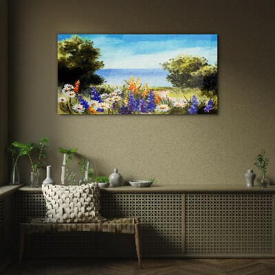 Tableau imprimé sur verre Paysage avec des fleurs au bord de la mer