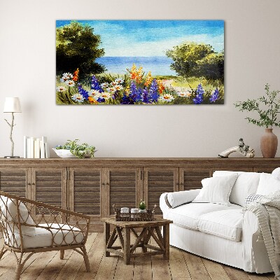 Tableau imprimé sur verre Paysage avec des fleurs au bord de la mer